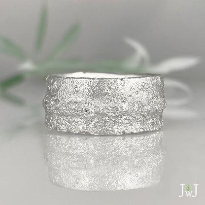 Wide white gold sand textured wedding band